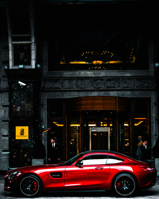 Luxury Elegance: Red Sports Car at The Ritz-Carlton Art Print | Urban Sophistication